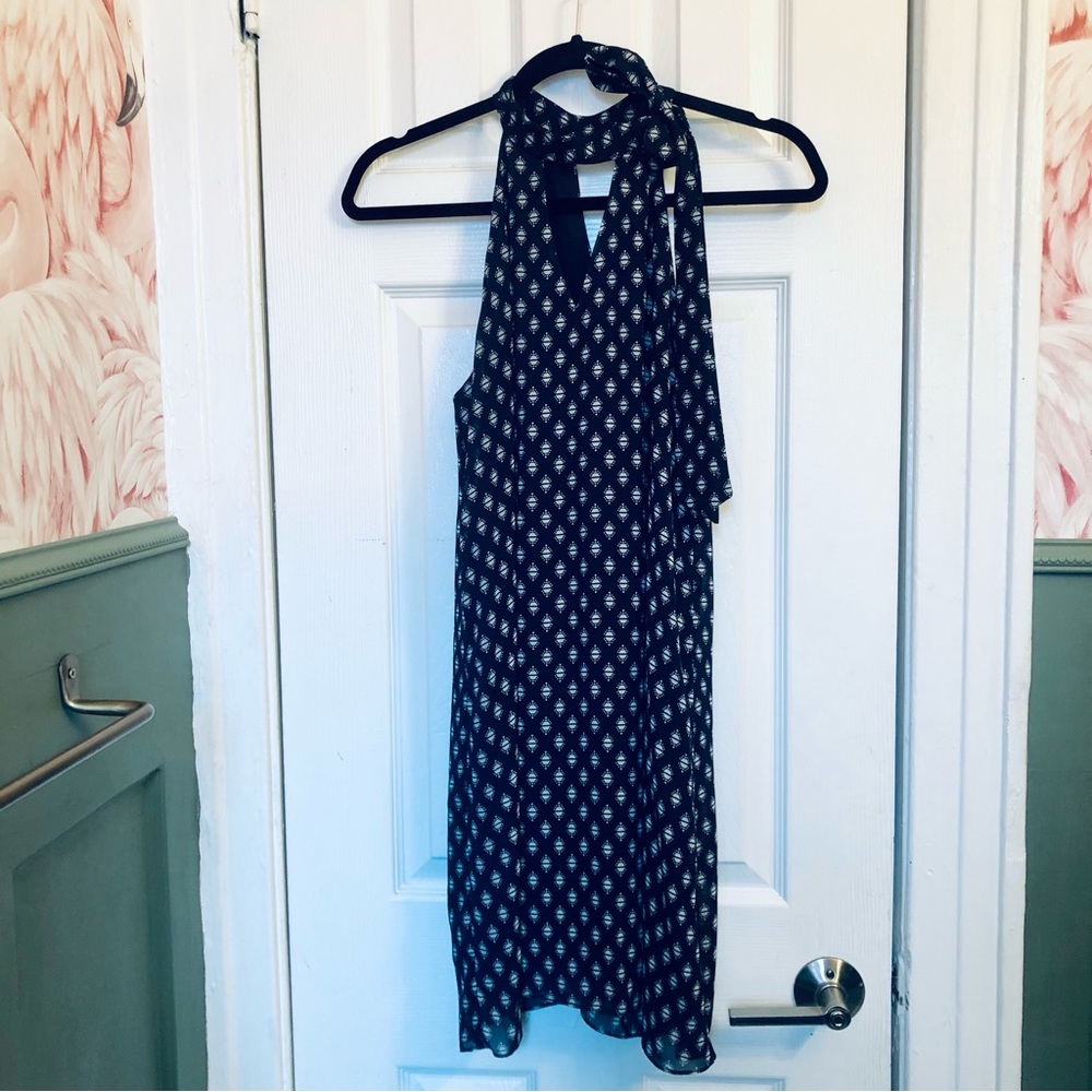 Fun and flirty! The Vanity Room blue and white mini dress with tie at neck. Sz s